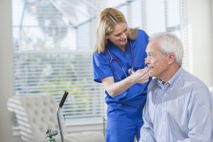Home-healthcare-nurse-helping-elderly-man-with-oxygen-540492430_2125x1416-900×600